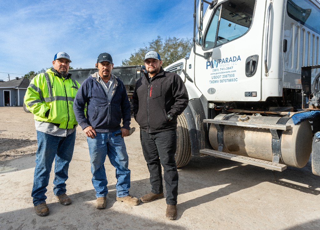 Parada Waste team members standing next to truck